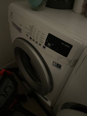an image of a washer and dryer in a small room