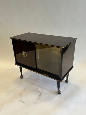 an image of a small black cabinet with a glass door