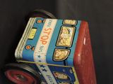 a toy bus that is sitting on a black surface