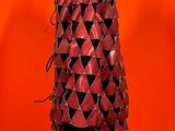 an image of a mannequin dress made out of red and black triangles