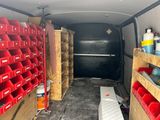 a van that has a lot of bins in the back