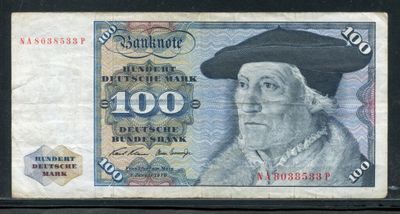 un vieux billet de banque sur lequel figure l'image d'un homme portant un chapeau
