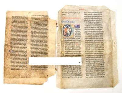 an open book with two pages and a pen on top of it