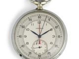a close up of a silver pocket watch on a white background