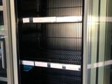 a refrigerator that has a lot of shelves inside of it