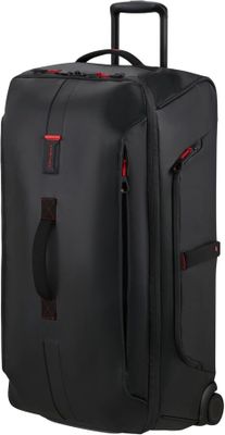 La valise noire est munie d'une poignée rouge et d'une autre poignée.