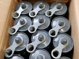 a box full of cans of soda sitting on a table