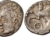 a silver coin with an image of a man on it