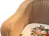 a chair that has a cushion on it and a pillow on it