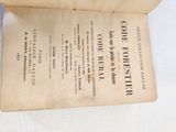 an old book that is open on a table
