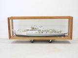 wooden display case with a model of a ship inside of it
