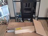 a cardboard box that is sitting on the floor next to a television