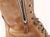 a close up view of a pair of boots with zippers