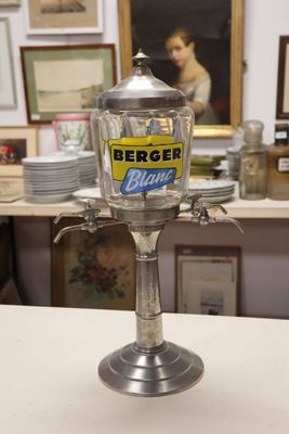 a silver cup that is sitting on top of a counter