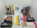 a lot of makeup and eyeliners on the table