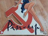a sticker with a pinup girl sitting on top of it