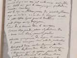 a book with a handwritten page in it on a table