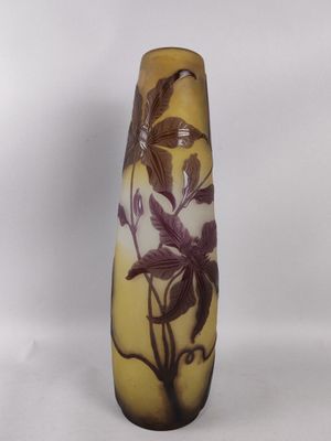 an image of a vase with purple flowers on it