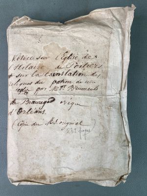 a piece of paper with writing on it sitting on top of a table