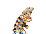une image représentant une figurine d'un homme tenant une batte de baseball