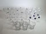 a lot of glasses that are sitting on a table