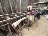 several pieces of wood are stacked on top of each other in a warehouse