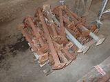 a pile of rusted pipes sitting on a pallet