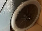 a close up of a cardboard box with a machine inside of it