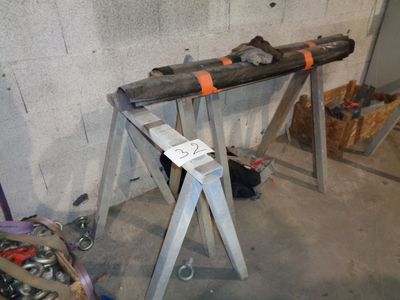 a large piece of wood sitting on top of a metal stand