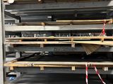 a large stack of steel plates stacked on top of each other in a warehouse