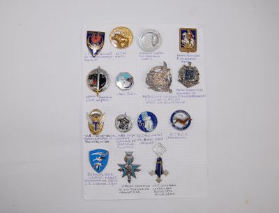 a lot of badges on a piece of paper