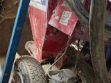 a small machine that is sitting in the dirt