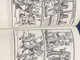 two pages of a comic book on a table
