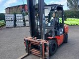 a forklift that is parked in a parking lot