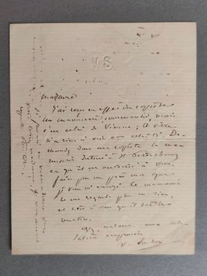 une vieille lettre écrite à la main sur un morceau de papier avec une écriture dessus