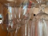 many wine glasses stacked on top of each other