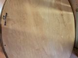 an overhead view of a wooden table with a clock on it