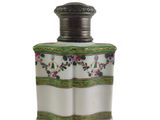 an image of a white and green vase with flowers on it