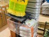 a stack of boxes on a pallet in a warehouse