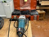 an image of a workbench with a drill and other tools on it