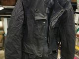 an image of a jacket hanging on a rack in a store