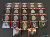 a lot of different types of badges on a table