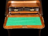 an image of a desk with a green mat on top of it
