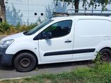 a white van that is parked in a parking lot