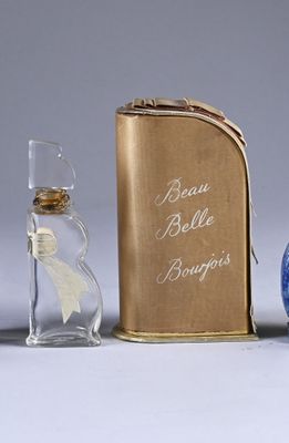 three bottles of perfume sitting next to each other on a table