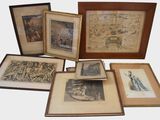 a lot of framed pictures on the table