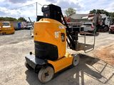 a yellow machine that is sitting in the dirt