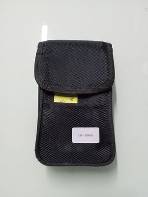 a small black pouch with a yellow tag on it