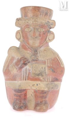 une image représentant une figurine en argile d'un homme tenant un livre