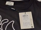 a t - shirt with a picture of a bird on it